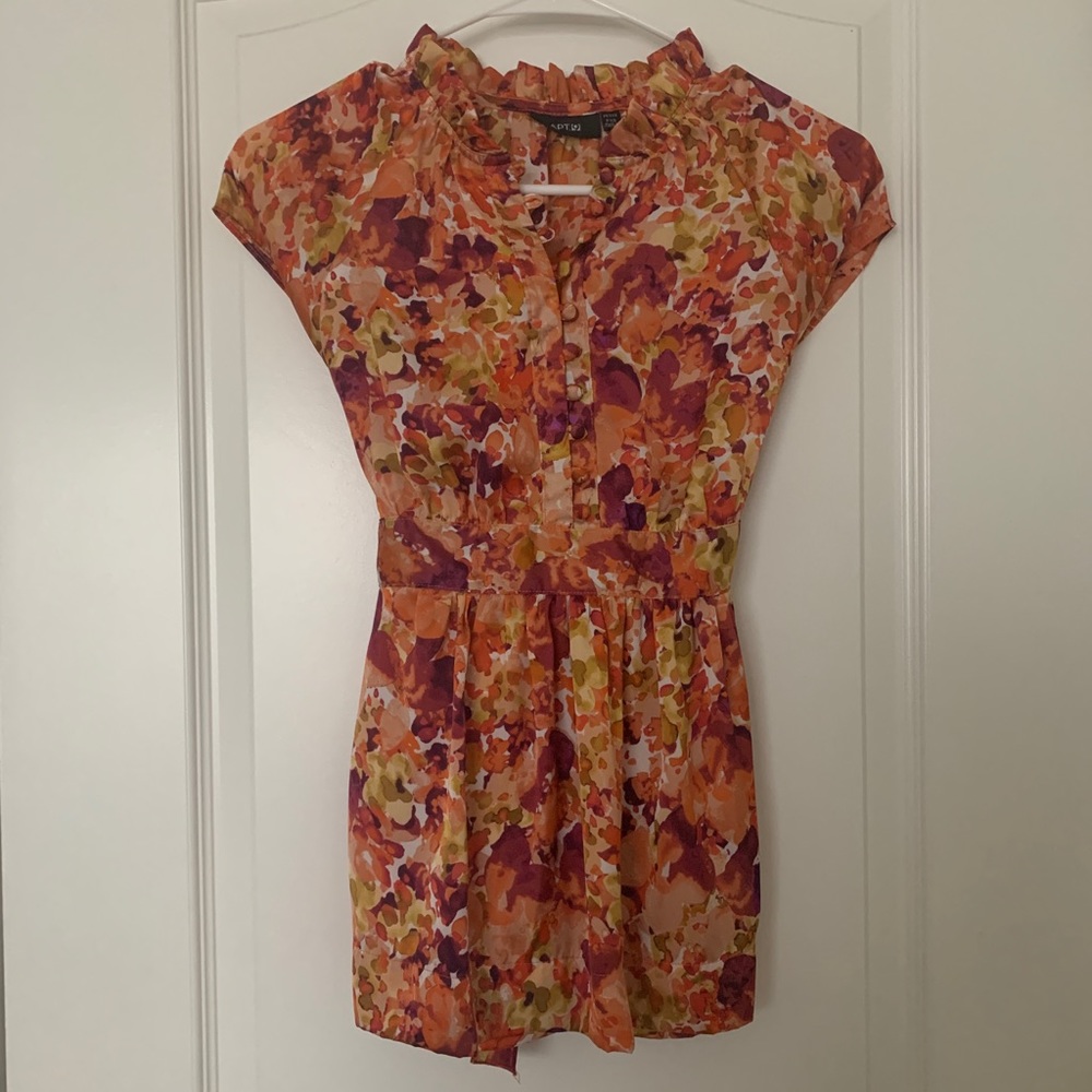 Women’s orange and yellow shirt
